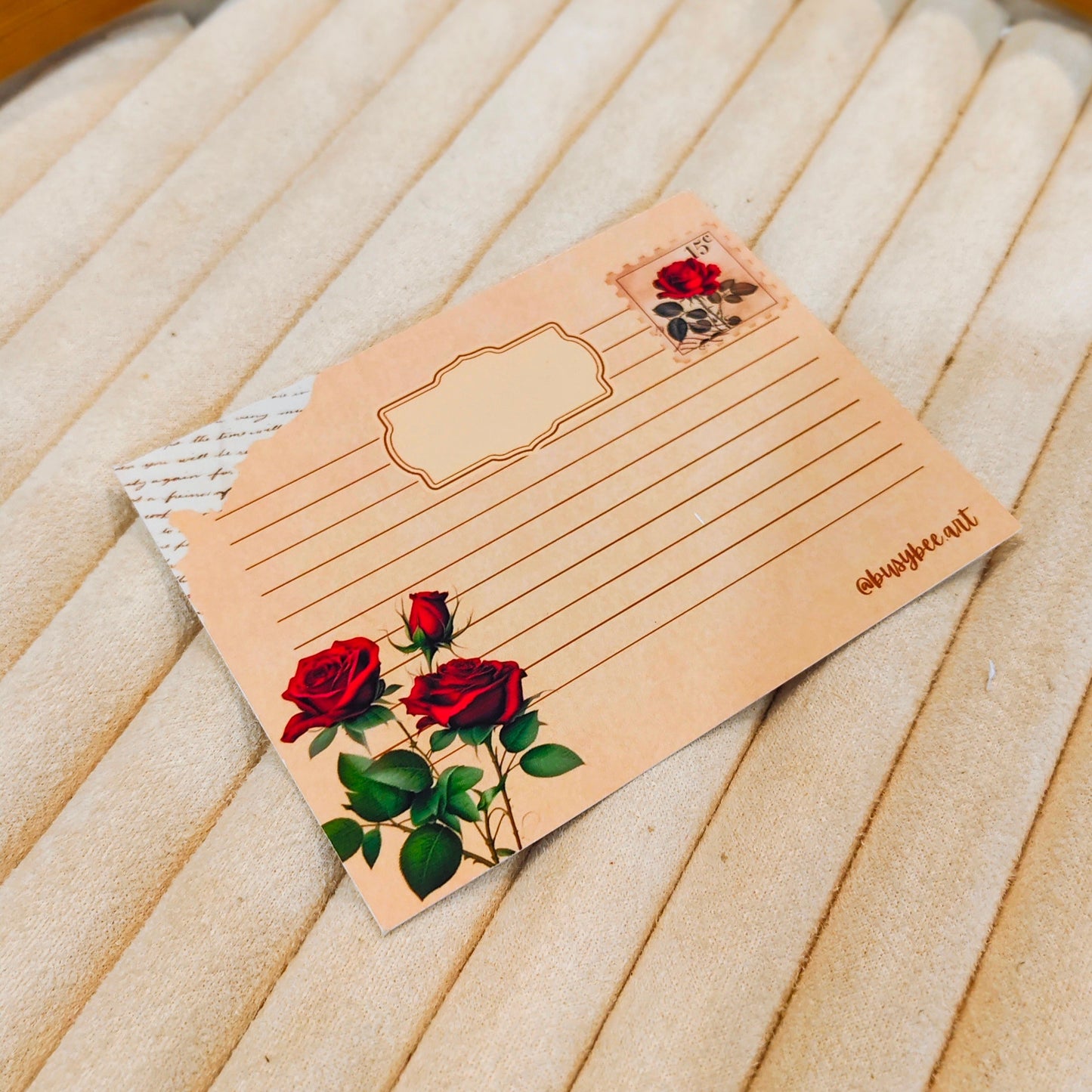 Notebook with rose designs on a wooden surface