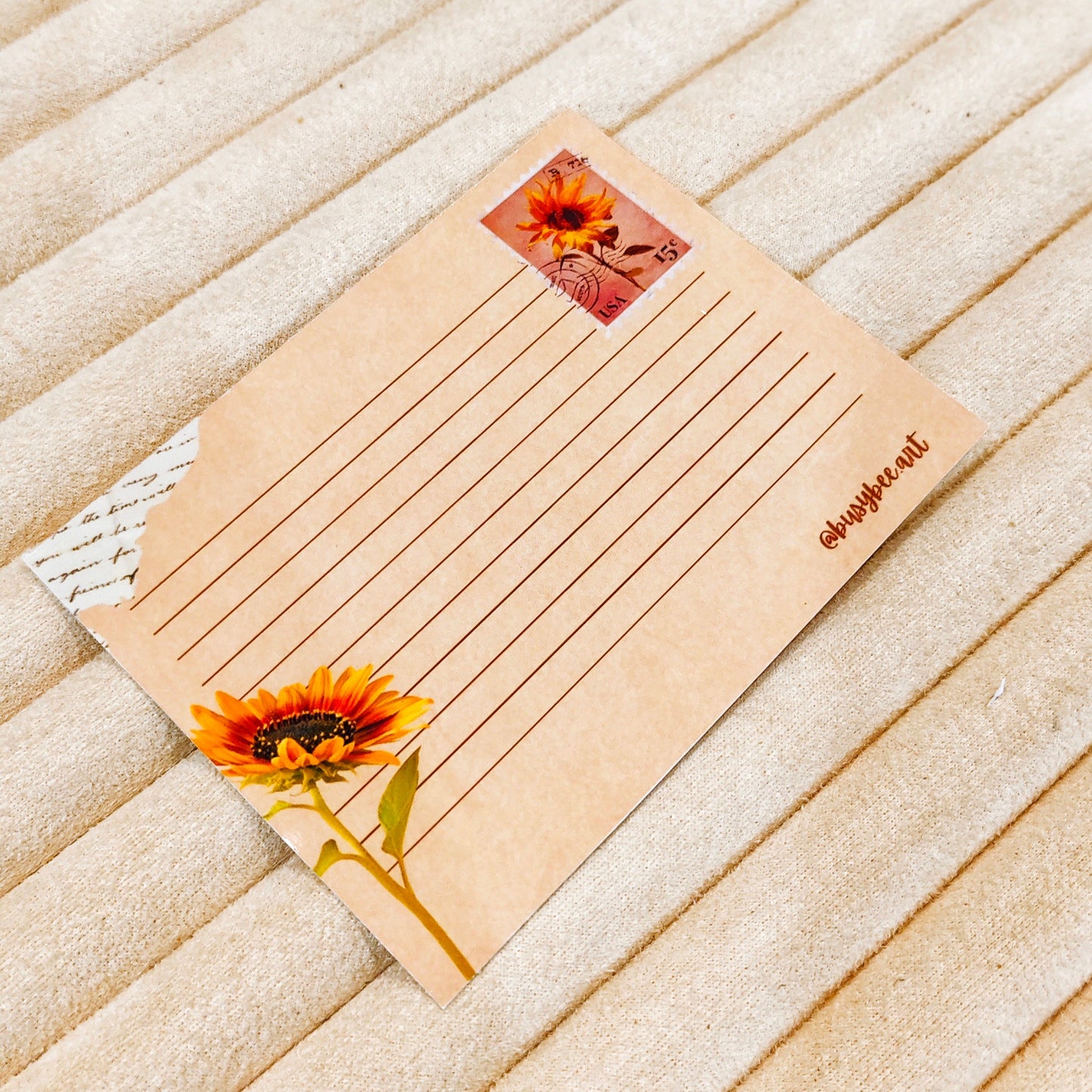 Kraft paper notepad with sunflower design on a wooden surface