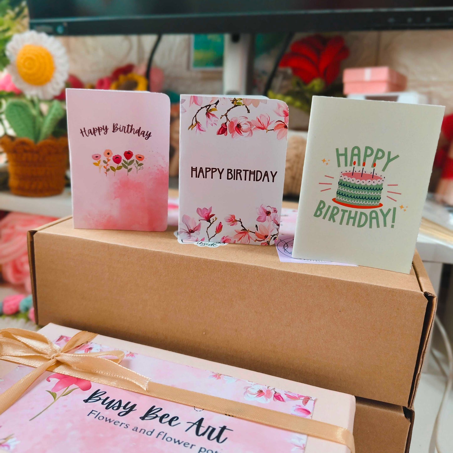 Three birthday cards on a box with 'Busy Bee Art' branding.